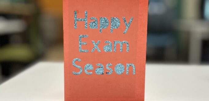 orange card with sparkly blue text reading "Happy Exam Season"